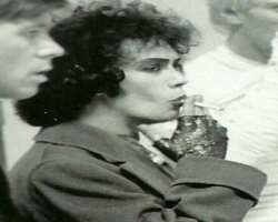 Tim Curry smoking
